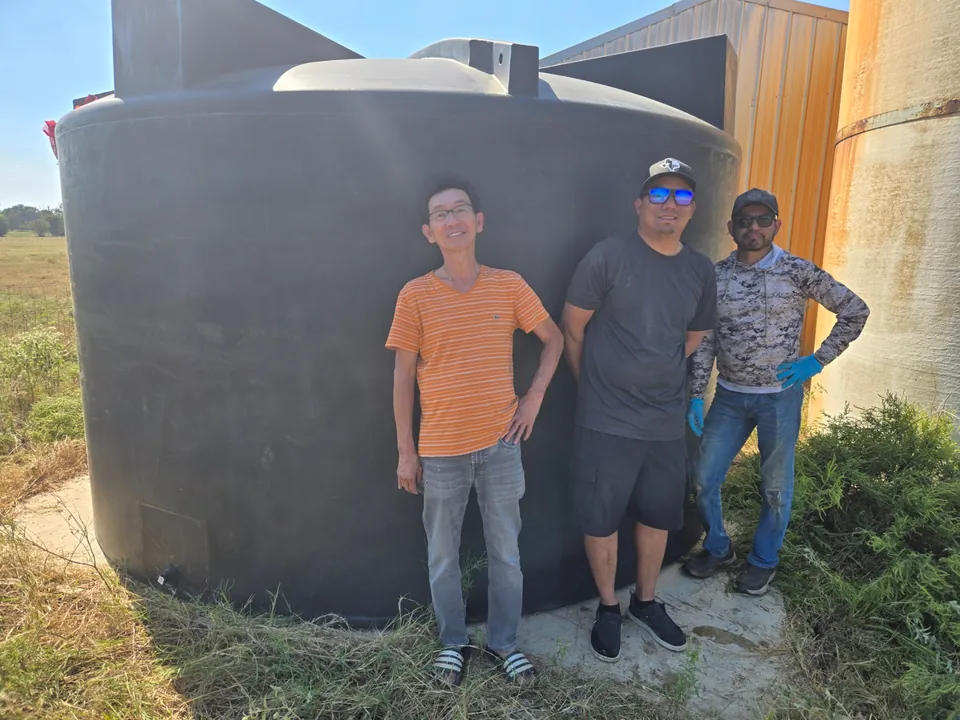 Round black rainwater tank