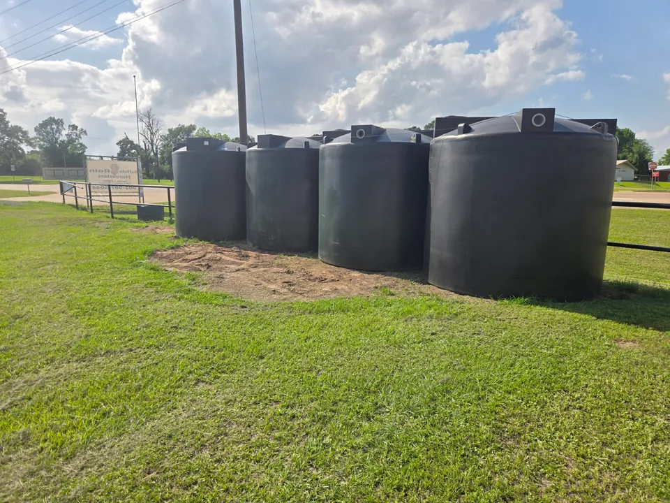 Multiple black rainwater storage tanks